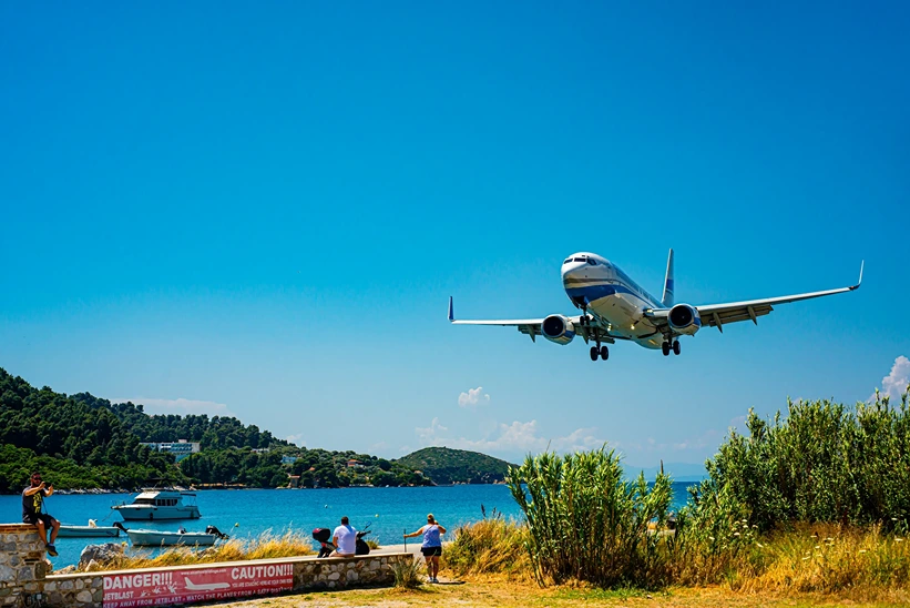 Skiathos, Greece - Jun 11th, 2019: Skiathos Airport is one of the airports with a shortest runway. It’s located near the road and beach, so it is a popular destination for lot of tourist that make photos and watch airplane traffic