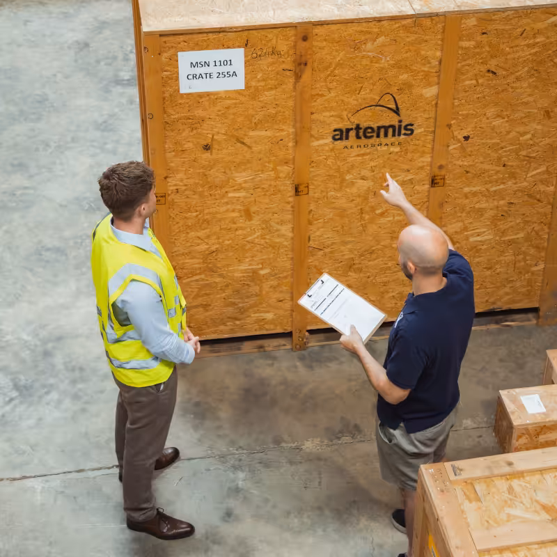 Artemis Aerospace warehouse workers locating aircraft parts for clients.